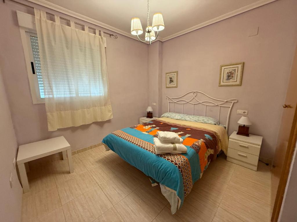 a bedroom with a bed and a window at F3-Costa Marina III World, Jovial - ServHouse in El Borseral