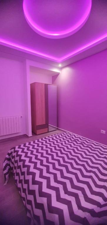 Postel nebo postele na pokoji v ubytování DAR KHOUALDIA