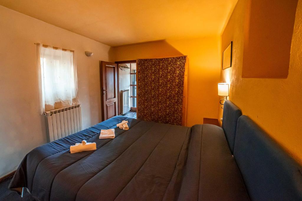 Letto o letti in una camera di Albergo Diffuso - Rocca Calascio