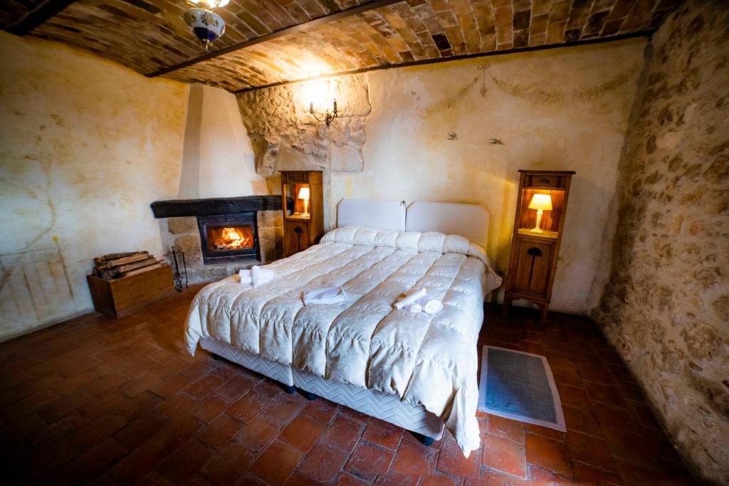 Letto o letti in una camera di Albergo Diffuso - Rocca Calascio