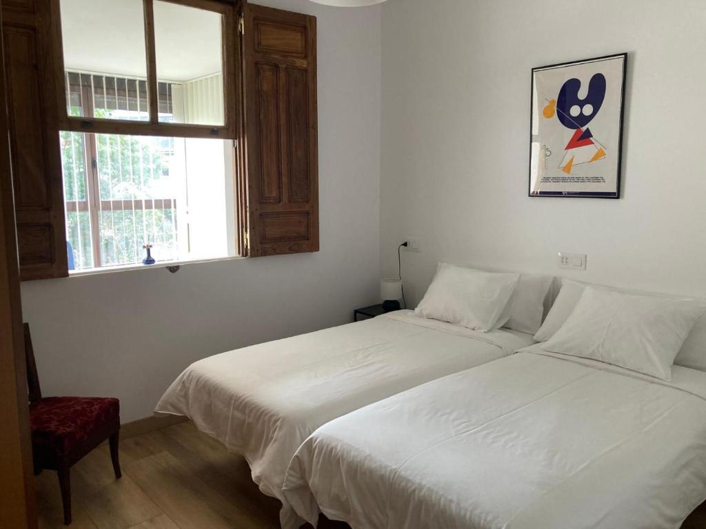 Posteľ alebo postele v izbe v ubytovaní Casa Morín, apartamento Ribeira Sacra