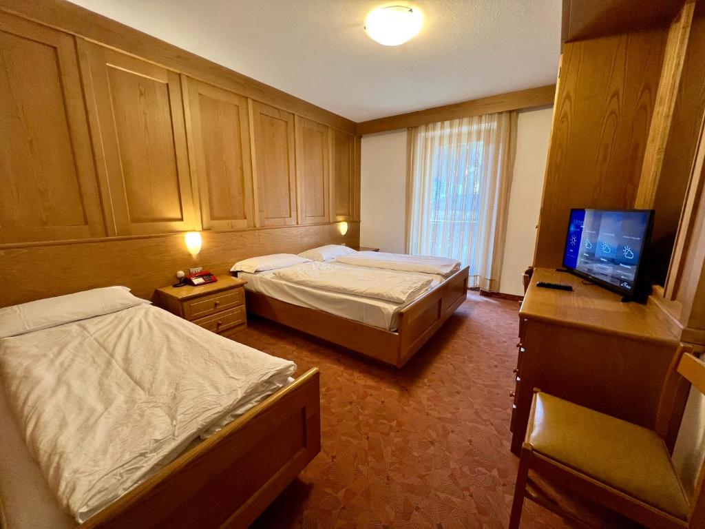 Postel nebo postele na pokoji v ubytování Hotel De Fronz
