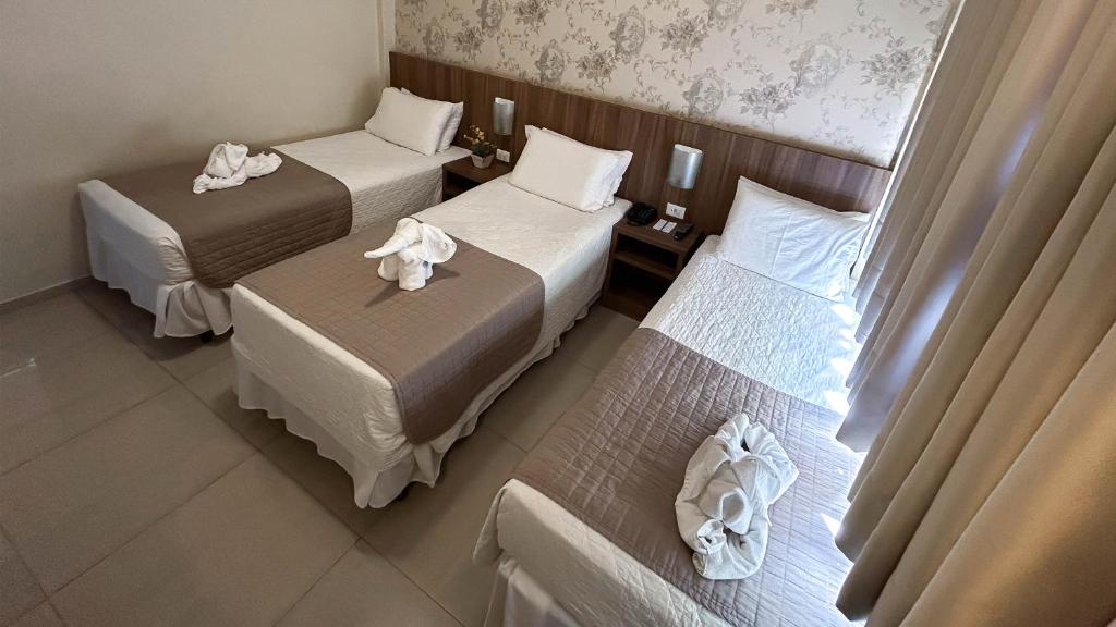 Postel nebo postele na pokoji v ubytování Pietro Angelo Hotel