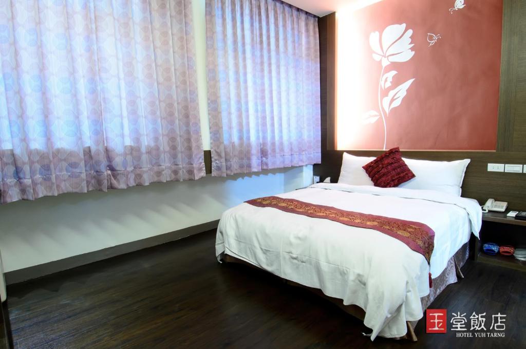 Postel nebo postele na pokoji v ubytování Yuh-Tarng Hotel