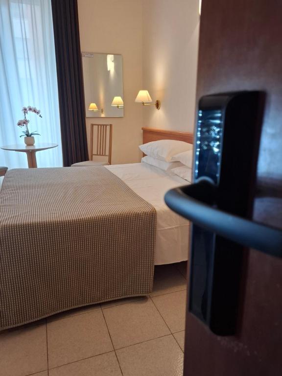 Postel nebo postele na pokoji v ubytování Hotel Principe Eugenio