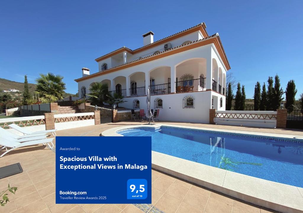 a large villa with a swimming pool in mediabase at Spacious Villa with Exceptional Views in Malaga in Casarabonela