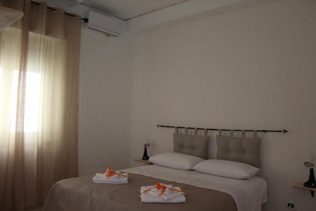 Postel nebo postele na pokoji v ubytování L'Arcipelago