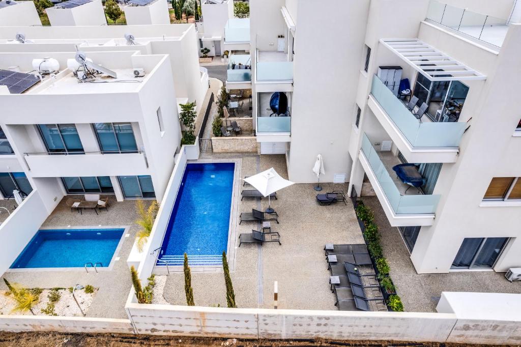 an aerial view of a building with a swimming pool at Anchora in Paralimni