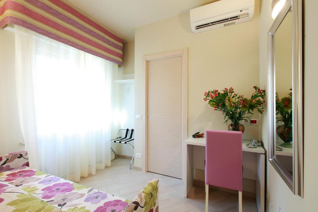 Postel nebo postele na pokoji v ubytování Hotel Souvenir