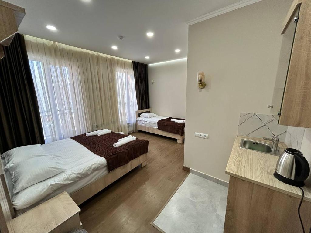 Postel nebo postele na pokoji v ubytování Guest House MARGARYAN