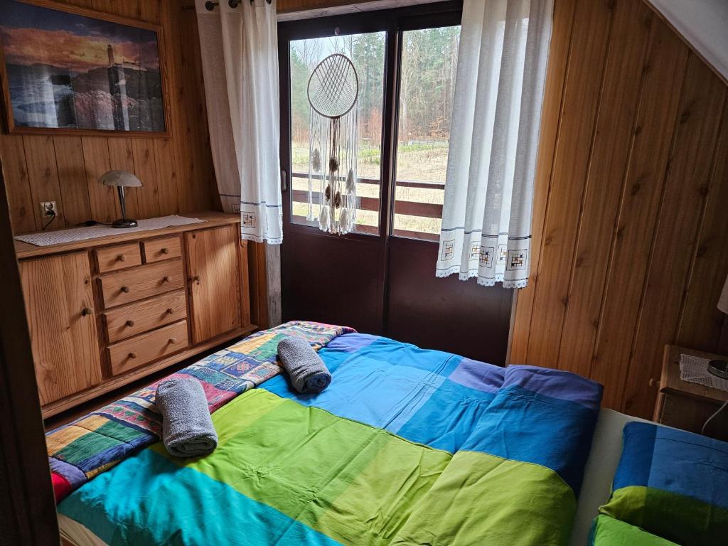 Postel nebo postele na pokoji v ubytování Grabówka
