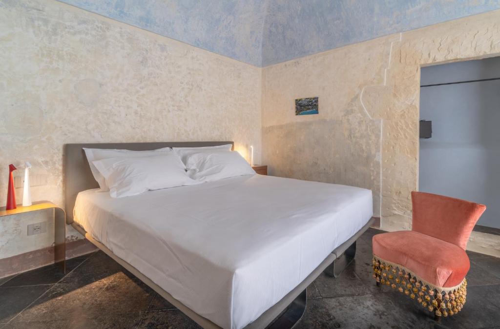 Postel nebo postele na pokoji v ubytování P43 Sicilian Suites