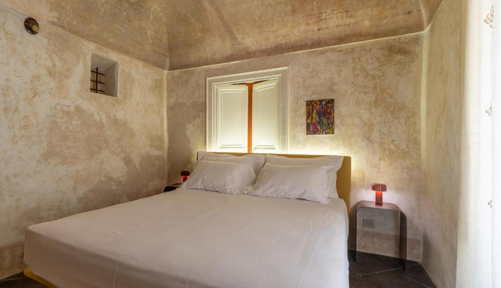 Postel nebo postele na pokoji v ubytování P43 Sicilian Suites