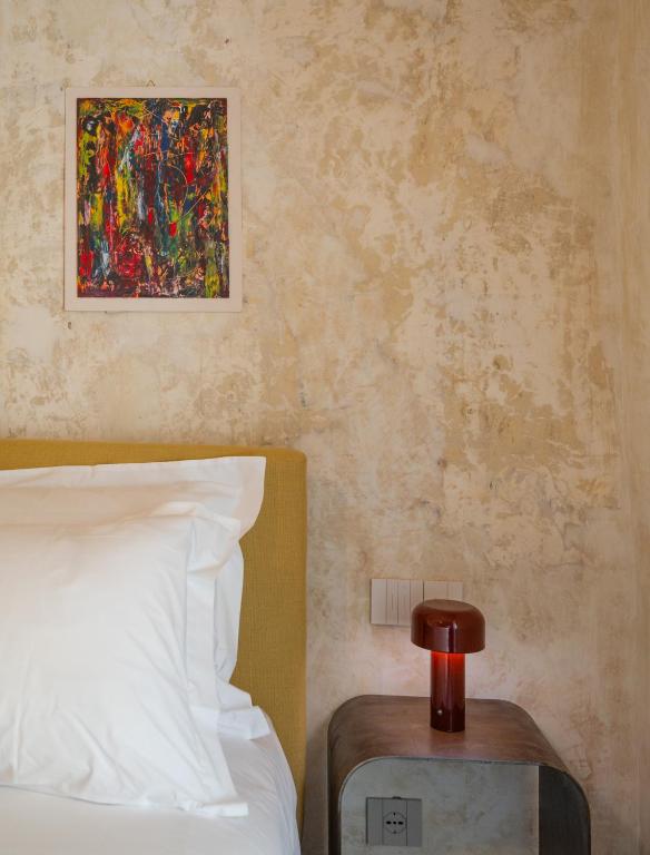 Postel nebo postele na pokoji v ubytování P43 Sicilian Suites