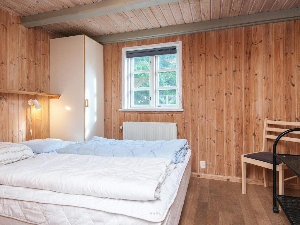 Postel nebo postele na pokoji v ubytování 14 person holiday home in Ulfborg