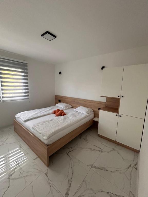 Postel nebo postele na pokoji v ubytování Apartmani Stars