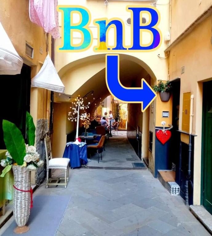 a sign for a restaurant with a sign for a pub at Casa Santiago in Alassio