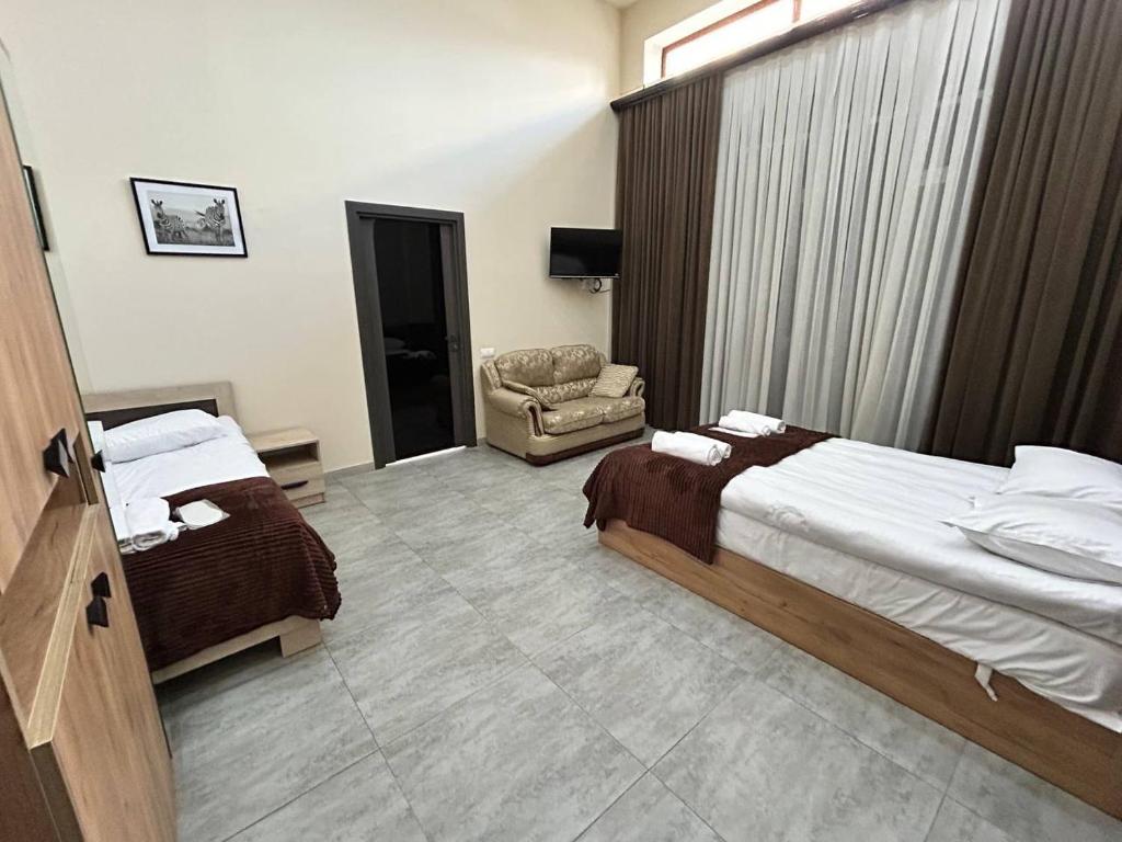 Postel nebo postele na pokoji v ubytování Guest House MARGARYAN