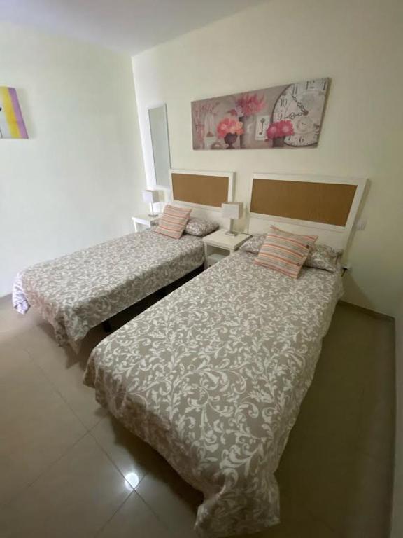 Postel nebo postele na pokoji v ubytování Apartment Los Hibiscos