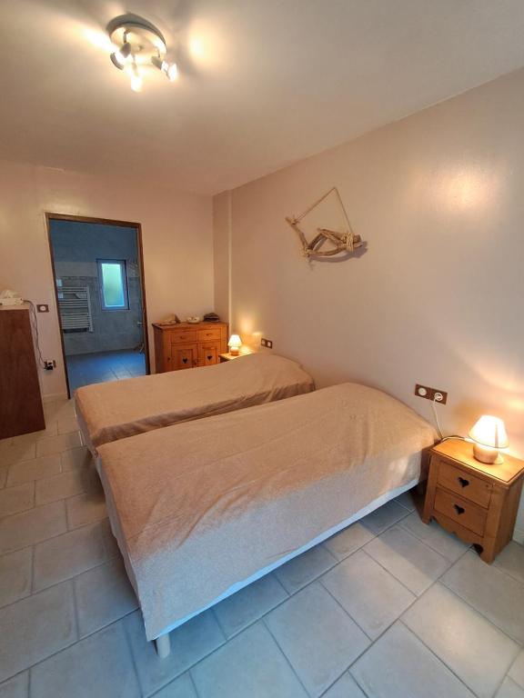 Postel nebo postele na pokoji v ubytování L'instant Beaun'heur
