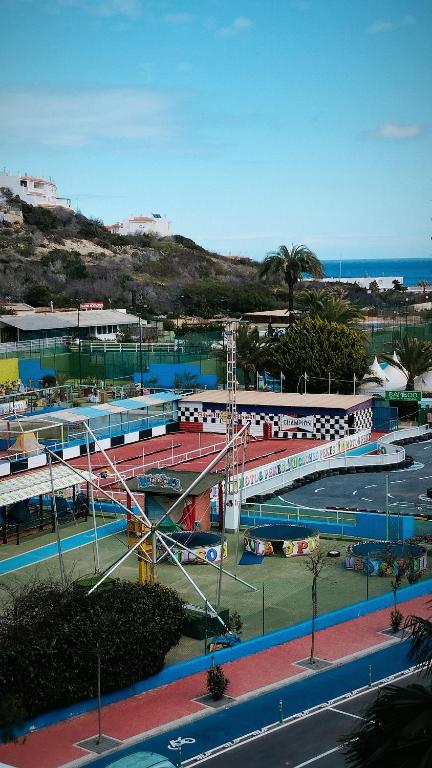 a view of a city with a train station at El buen sol de la manga in La Manga del Mar Menor