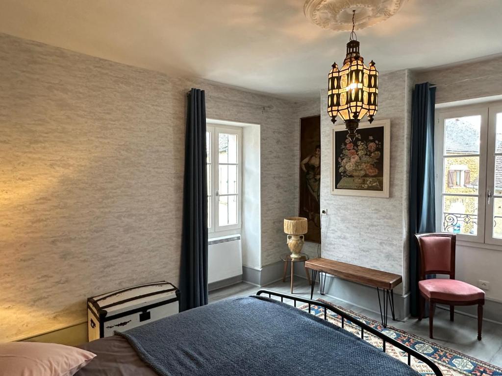 Ένα ή περισσότερα κρεβάτια σε δωμάτιο στο Maison de Laurent