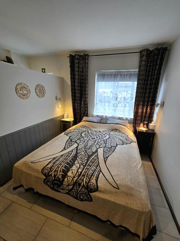 Postel nebo postele na pokoji v ubytování Lucy's Apartment
