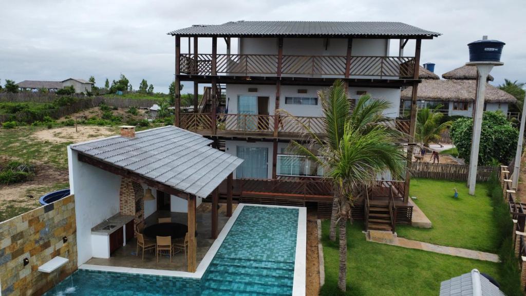 an aerial view of a house with a swimming pool at Home Beach at a Small Village in Cajueiro da Praia - Piauí - Brazil in Cajueiro
