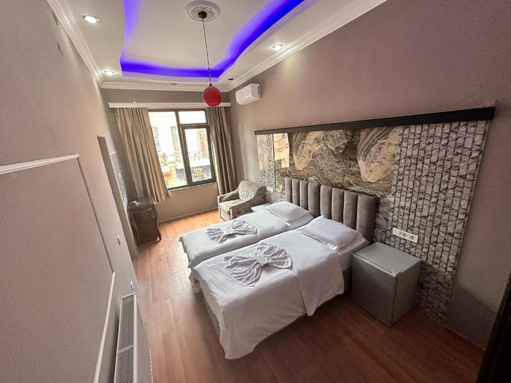 Postel nebo postele na pokoji v ubytování batummetropol hotel