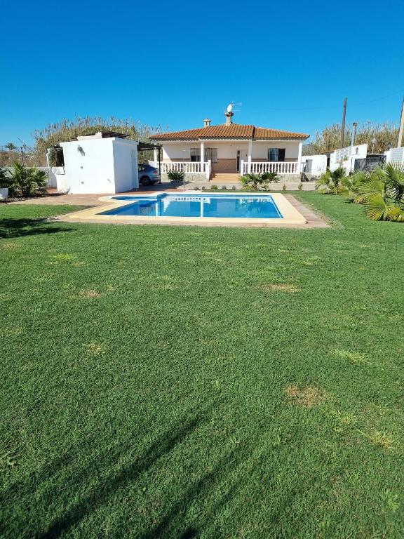 a house with a swimming pool in a yard at Villa Maruna in Grao de Castellón