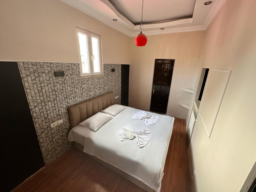 Postel nebo postele na pokoji v ubytování batummetropol hotel