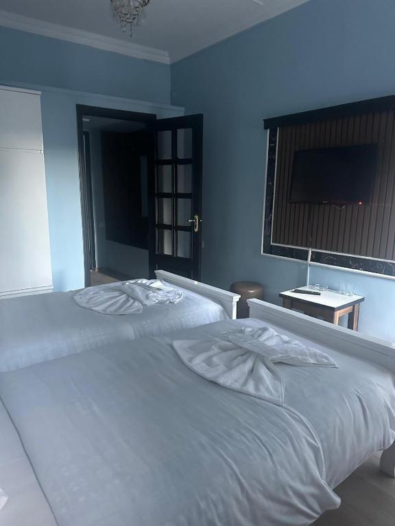 Postel nebo postele na pokoji v ubytování batummetropol hotel