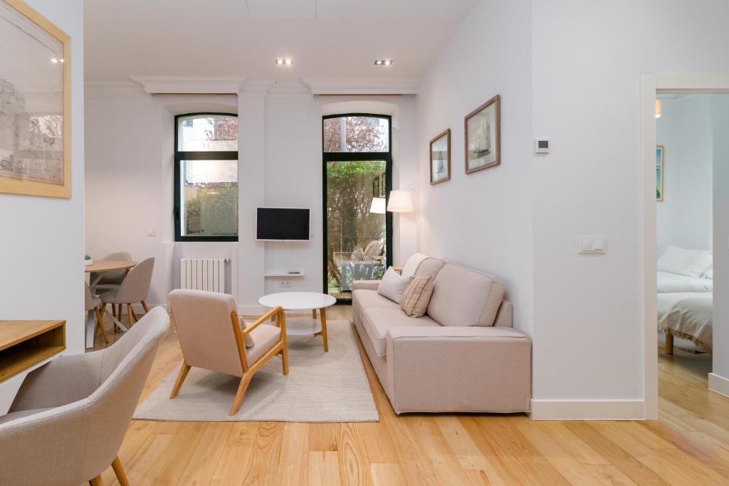 a living room with a couch and a table at Vivienda en el Sardinero in Santander