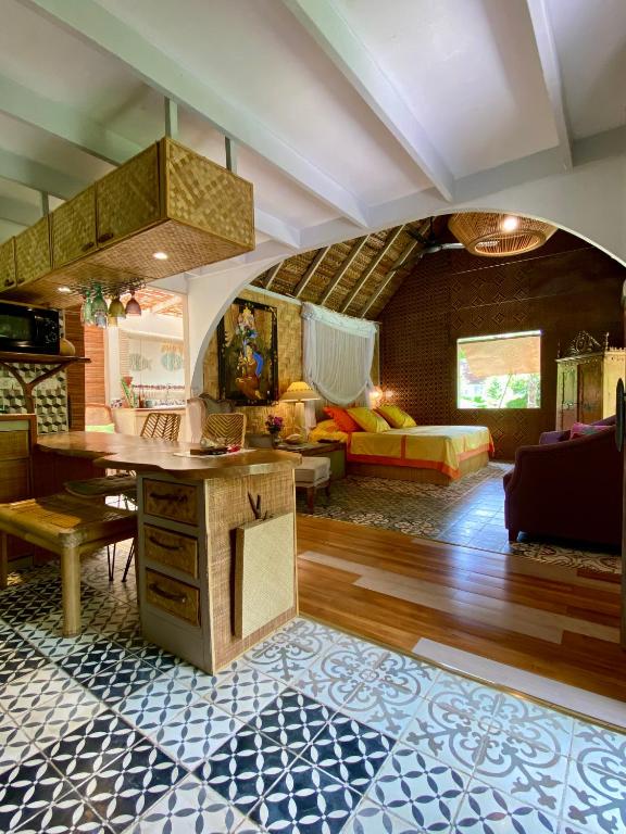 Posezení v ubytování LOFT VANILLE avec clim et piscine partagee