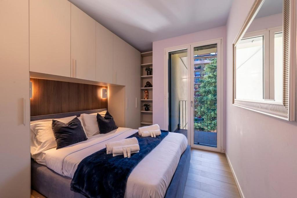 Ένα ή περισσότερα κρεβάτια σε δωμάτιο στο Duomo Design - Bilocale-Wifi-Aircon