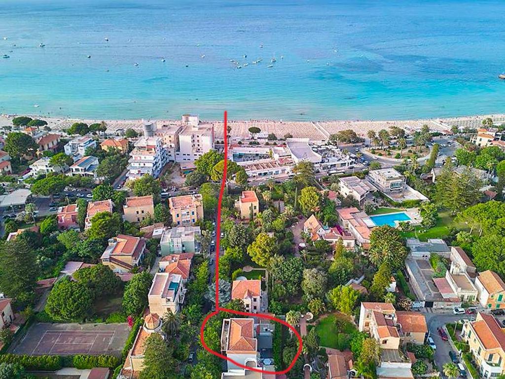 an aerial view of a city with houses and the ocean at Casa Lighea Mondello - 200 mt dalla spiaggia in Mondello