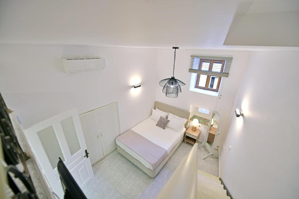 Postel nebo postele na pokoji v ubytování Psaropoula Guest House