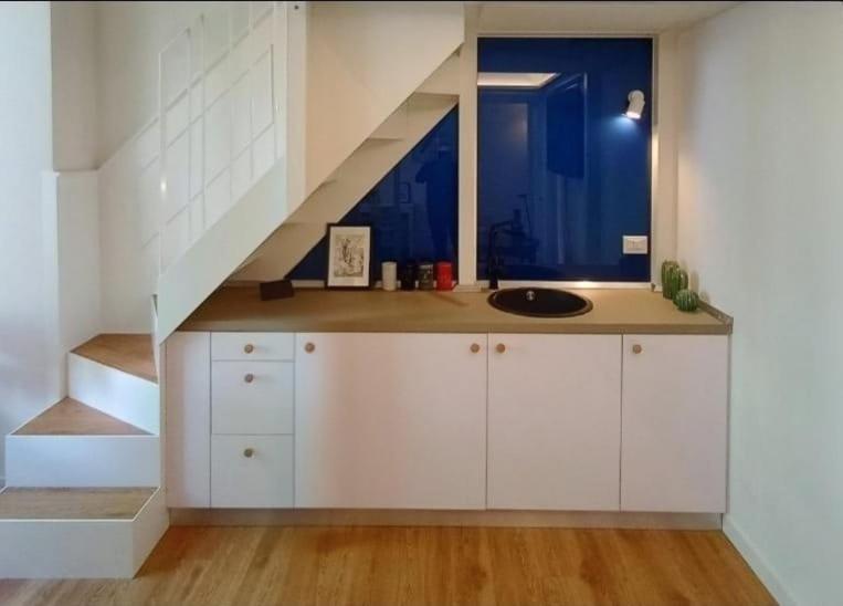 A kitchen or kitchenette at Tolli Colosseo Apartment