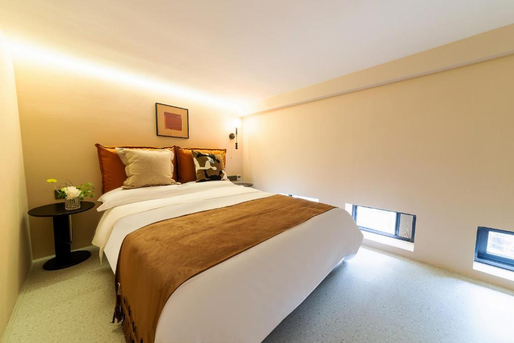Postel nebo postele na pokoji v ubytování Vishan Keys Hotel 维尚潮宿