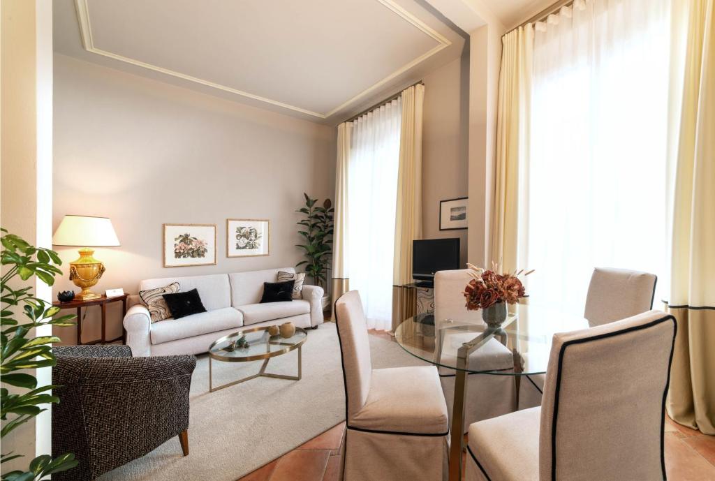 a living room with a couch and a table at Palazzo Alfani - Residenza d'Epoca in Florence