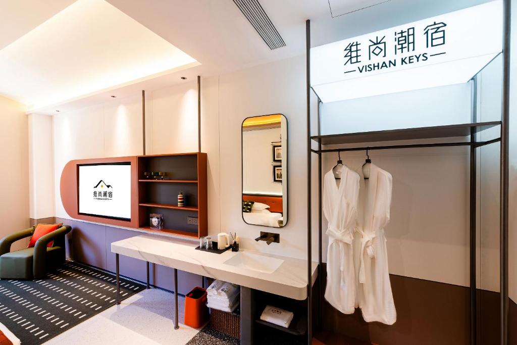 Postel nebo postele na pokoji v ubytování Vishan Keys Hotel 维尚潮宿