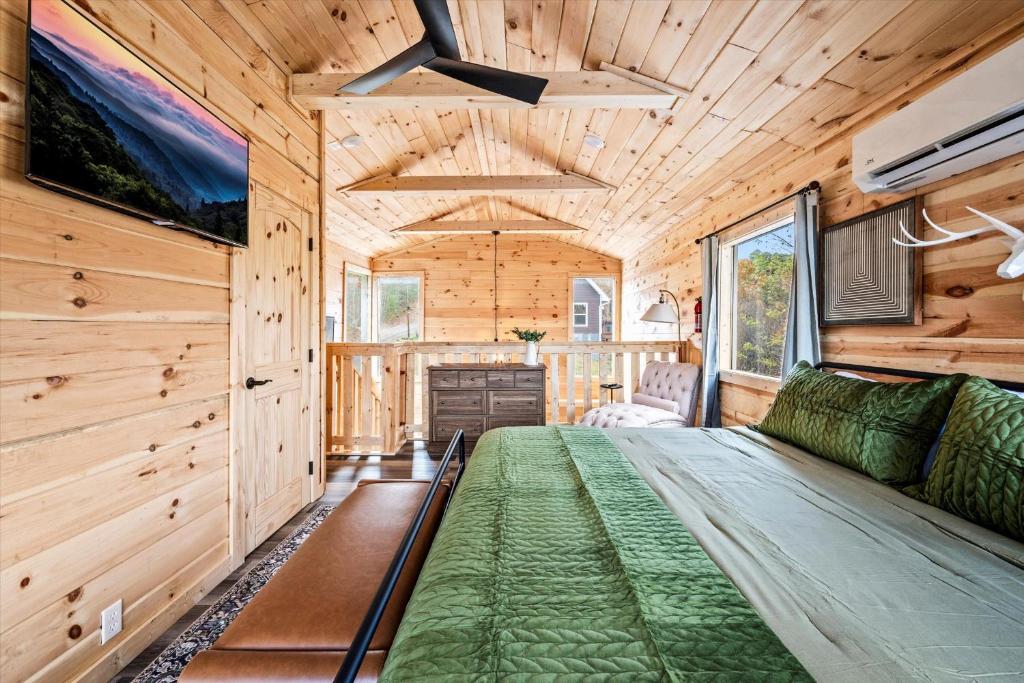 a living room in a log cabin with a couch at Holidays in Cozy Mountain Cabin - Near Dollywood, Parkway, Biggest Zipline - Hot Tub, Games, Hammock in Sevierville
