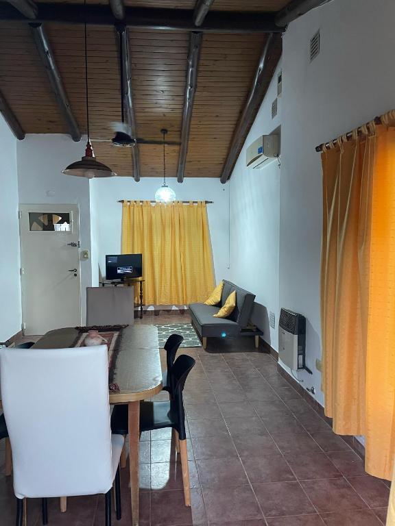 a living room with a couch and a table at Santa Teresita in Concepción del Uruguay
