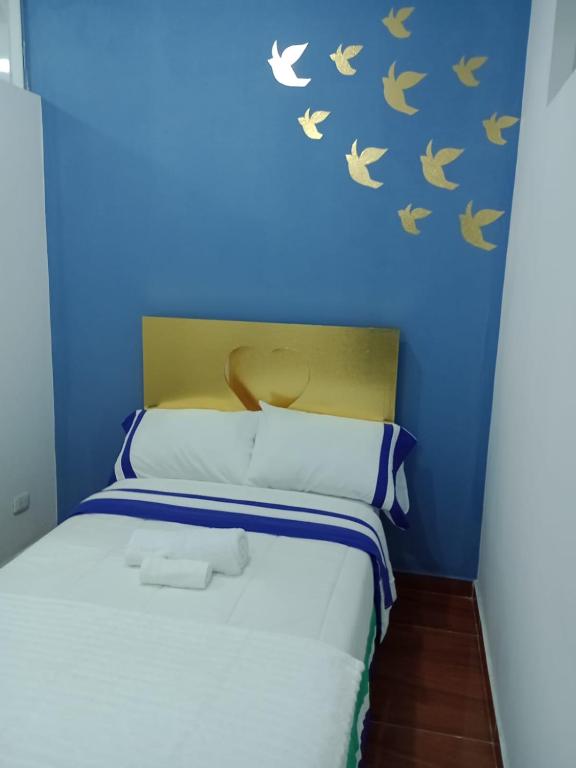 Postel nebo postele na pokoji v ubytování Puerta Azul Hospedaje