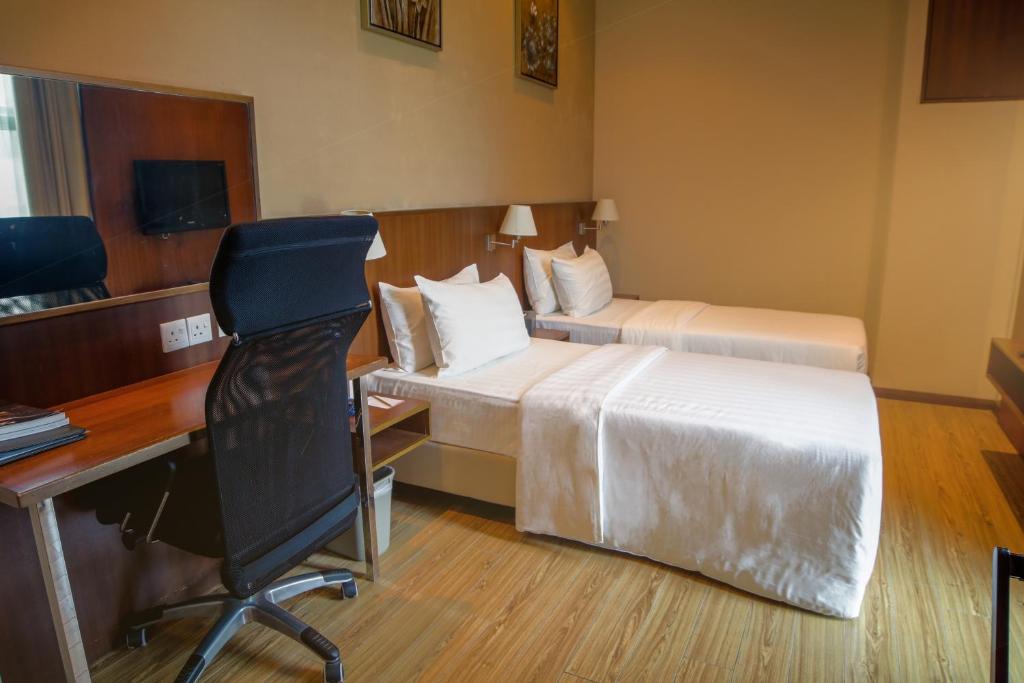 Кровать или кровати в номере Swiss Hotel Apartment