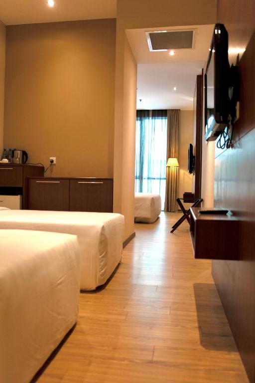 Телевизор и/или развлекательный центр в Swiss Hotel Apartment
