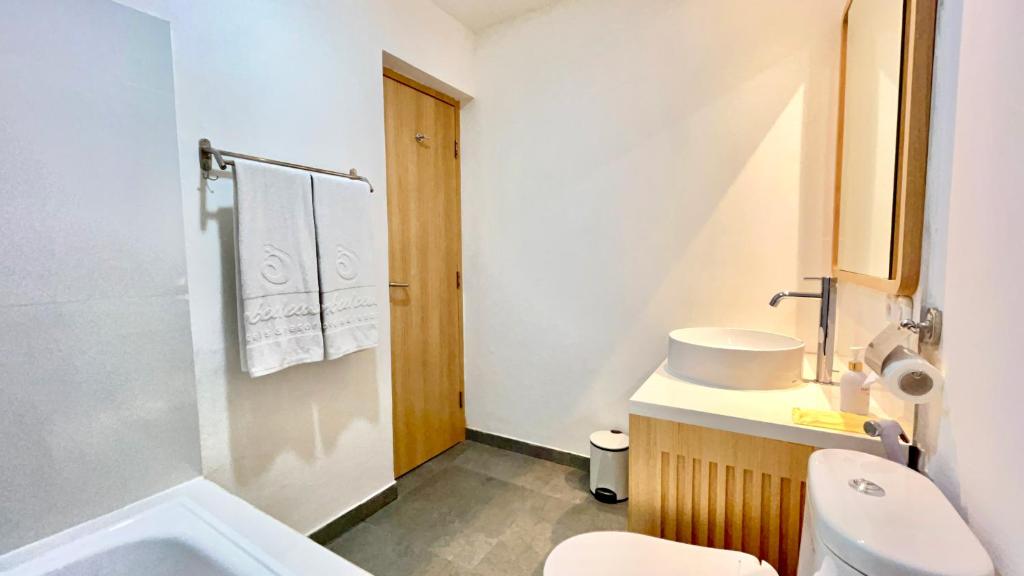 Koupelna v ubytování Jambuluwuk Residence Blok M