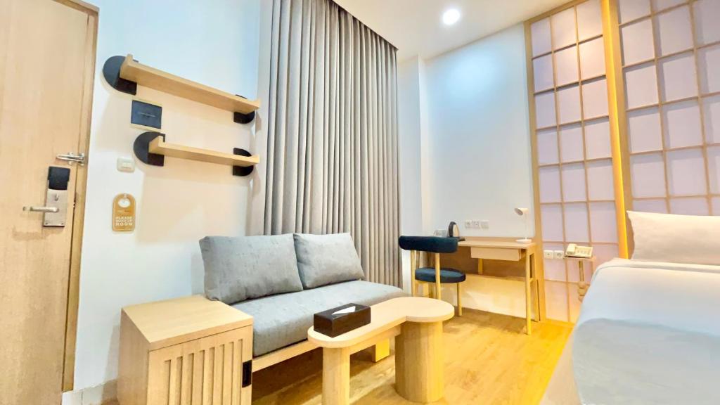 Posezení v ubytování Jambuluwuk Residence Blok M