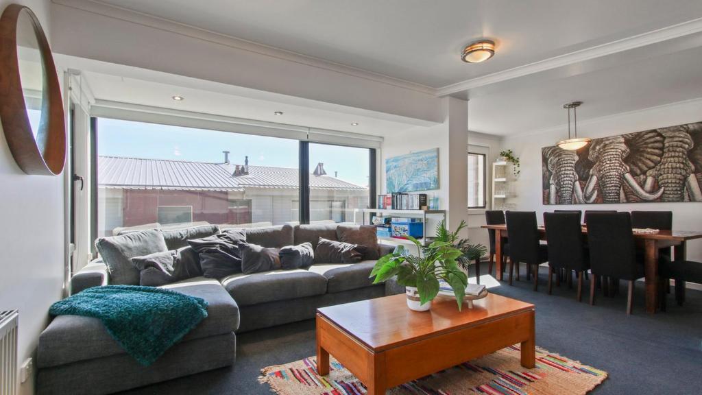 a living room with a couch and a table at Lawlers 30 in Mount Hotham