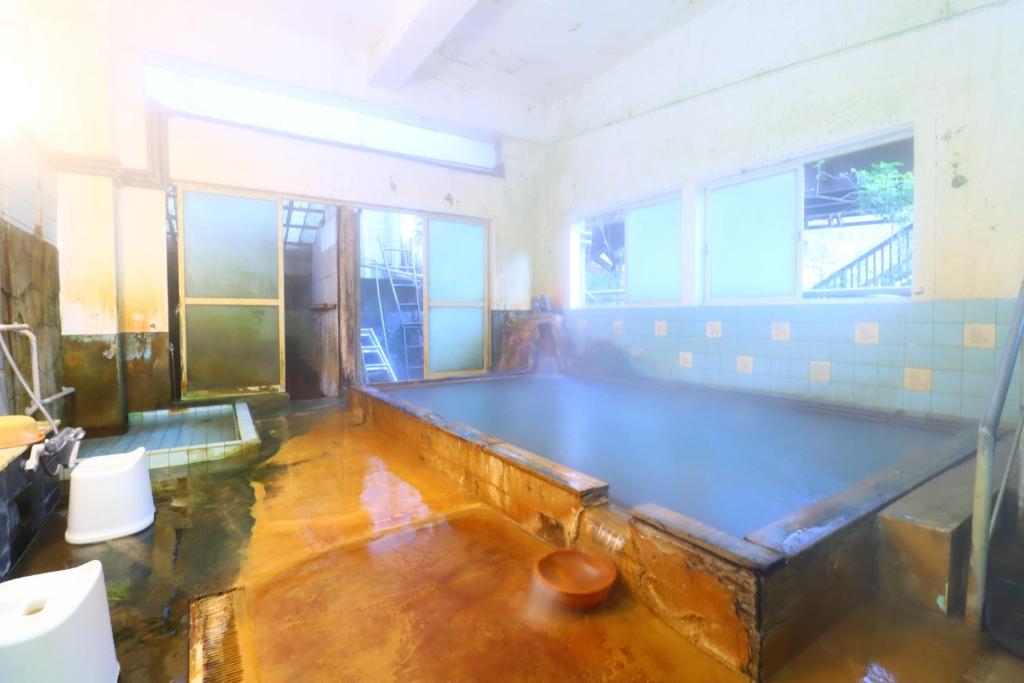 Posezení v ubytování 湯治の宿妙見館